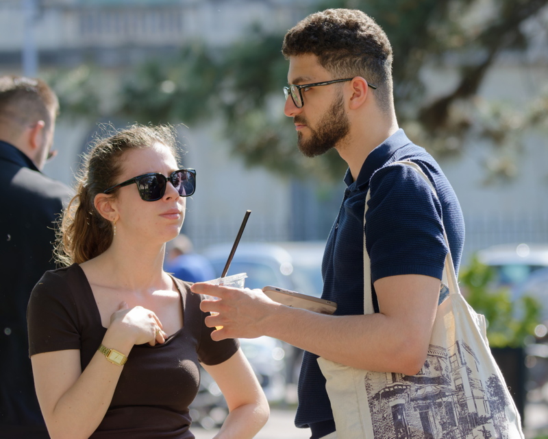 Two people standing together outdoors